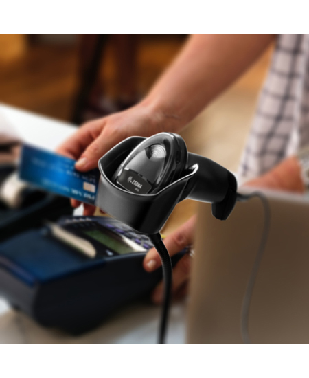 A DS2208 in a hands-free stand on a retail counter, being used to take a card payment.